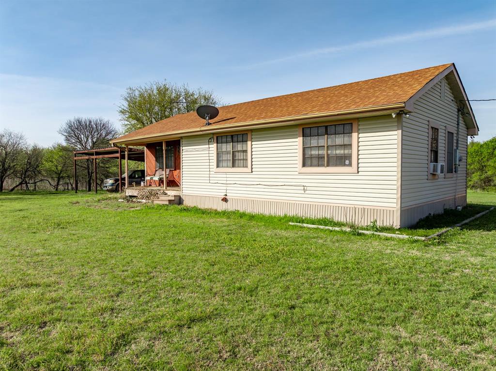 3692 Fm 66 Grandview, TX 76050 - Photo 22 of 39 a front view of a house with garden