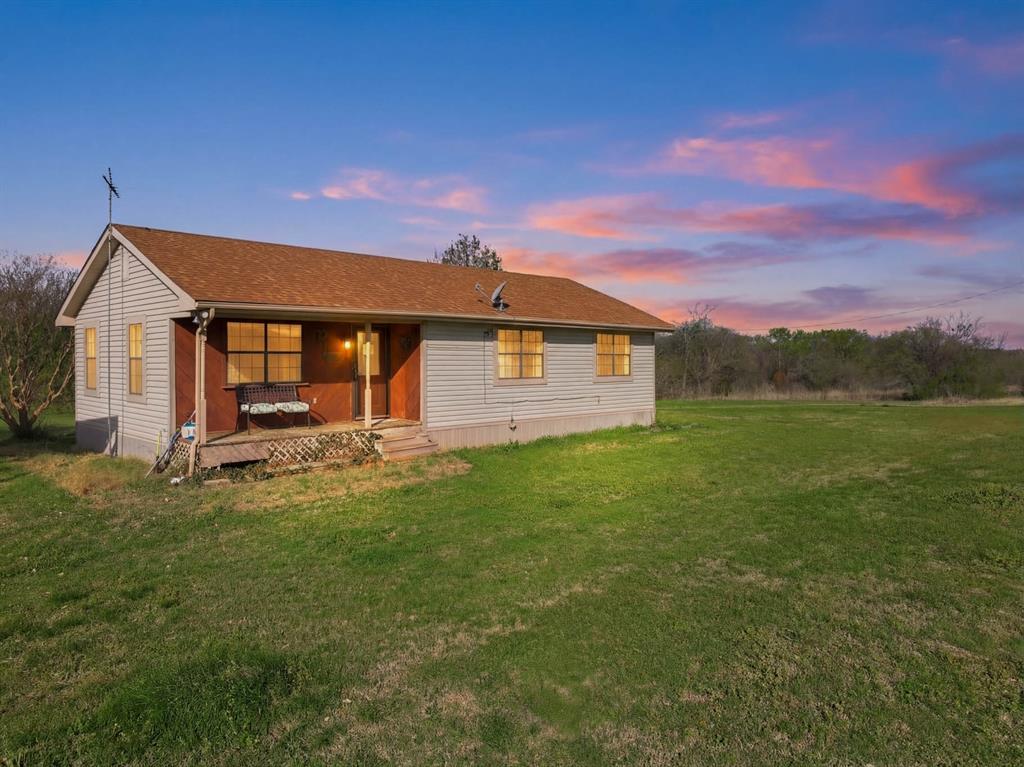 3692 Fm 66 Grandview, TX 76050 - Photo 5 of 39 a front view of a house with garden