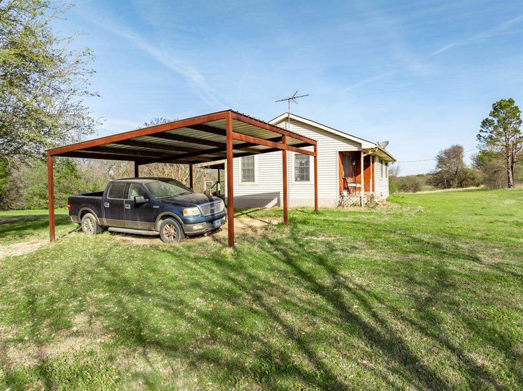 3692 Fm 66 Grandview, TX 76050 - Photo 7 of 39 a house with garden in front of it