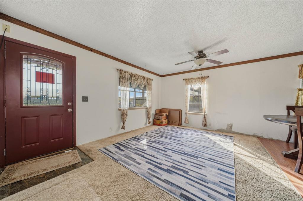 3692 Fm 66 Grandview, TX 76050 - Photo 8 of 39 a bedroom with a bed and a window