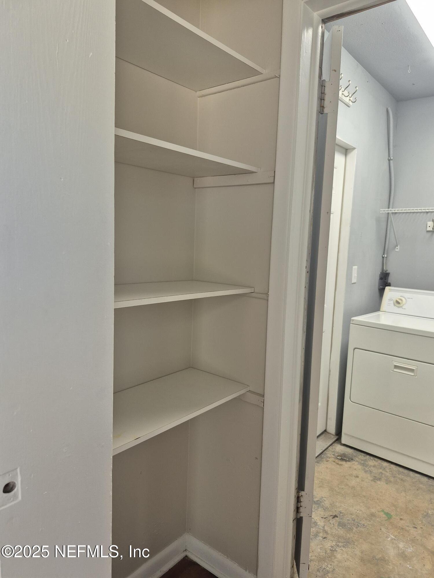 223 Edson Drive Orange Park, FL 32073 - Photo 12 of 21 a view of storage and utility room with washer and dryer