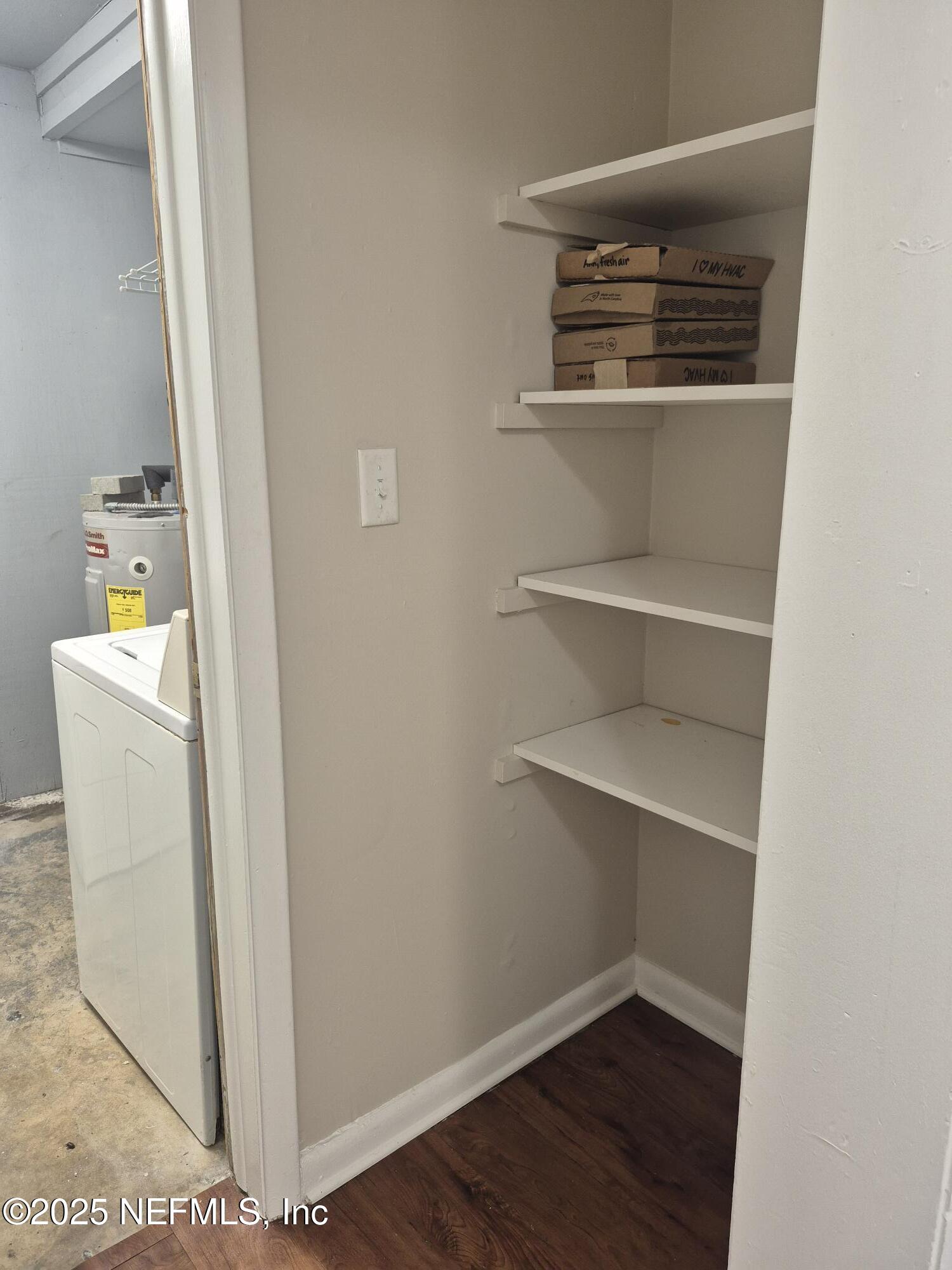 223 Edson Drive Orange Park, FL 32073 - Photo 13 of 21 a view of an empty room with wooden floor