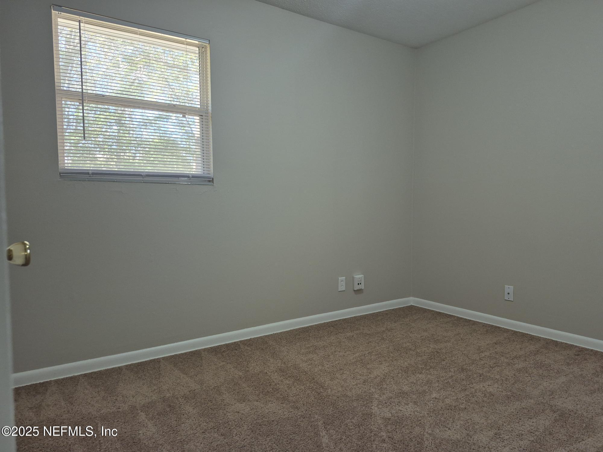 223 Edson Drive Orange Park, FL 32073 - Photo 16 of 21 an empty room with a window