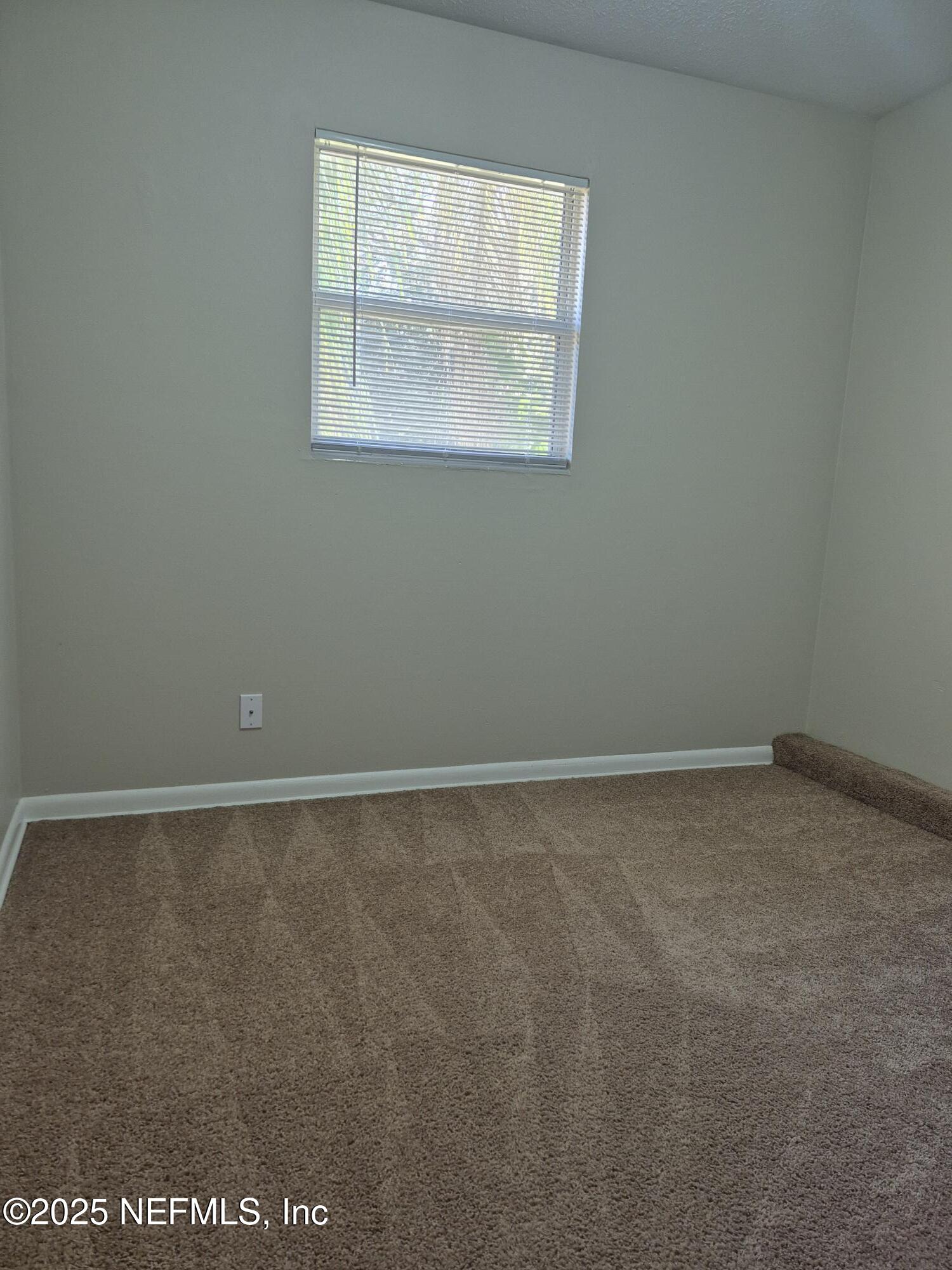 223 Edson Drive Orange Park, FL 32073 - Photo 17 of 21 a view of an empty room with a window