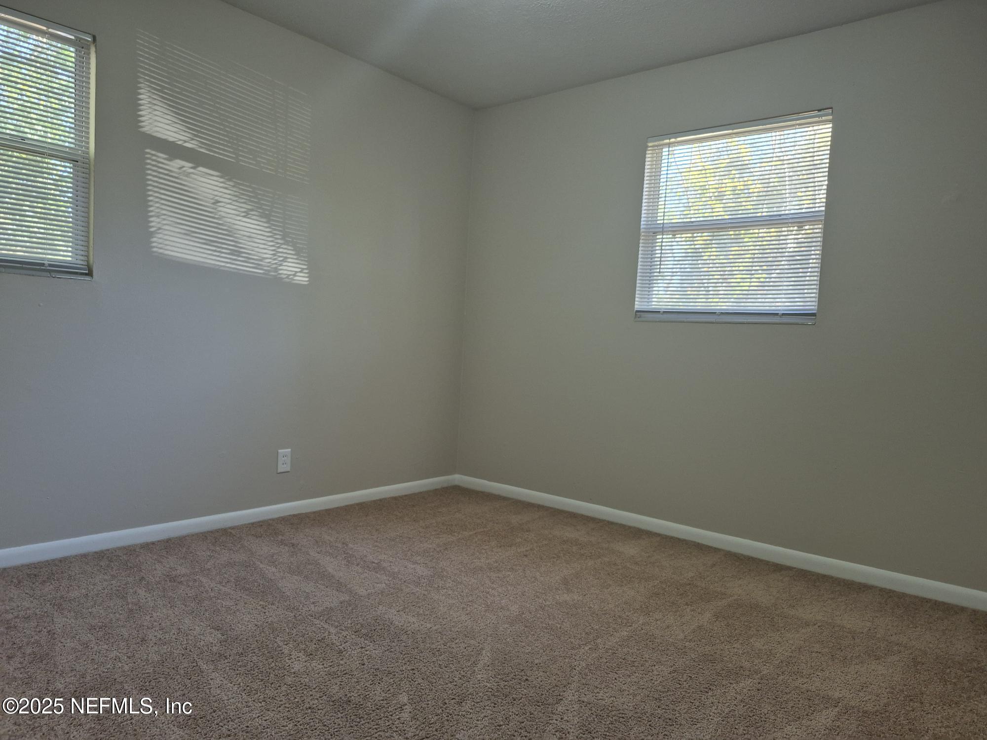 223 Edson Drive Orange Park, FL 32073 - Photo 18 of 21 an empty room with a window