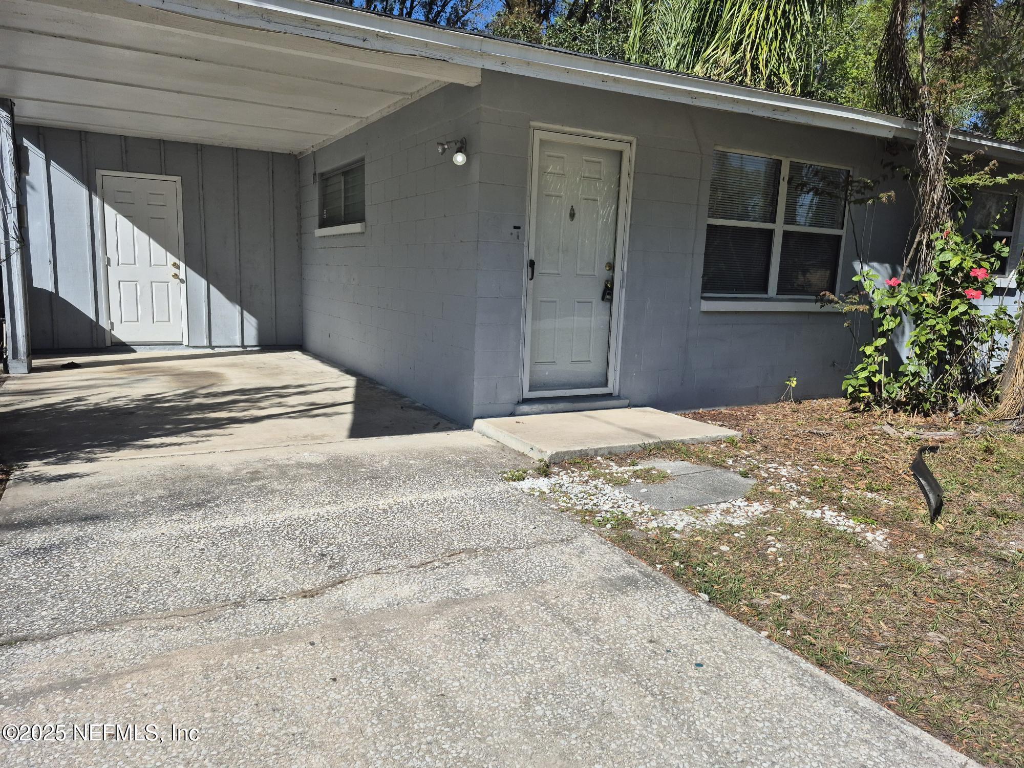 223 Edson Drive Orange Park, FL 32073 - Photo 3 of 21 a front view of a house with a yard and garage