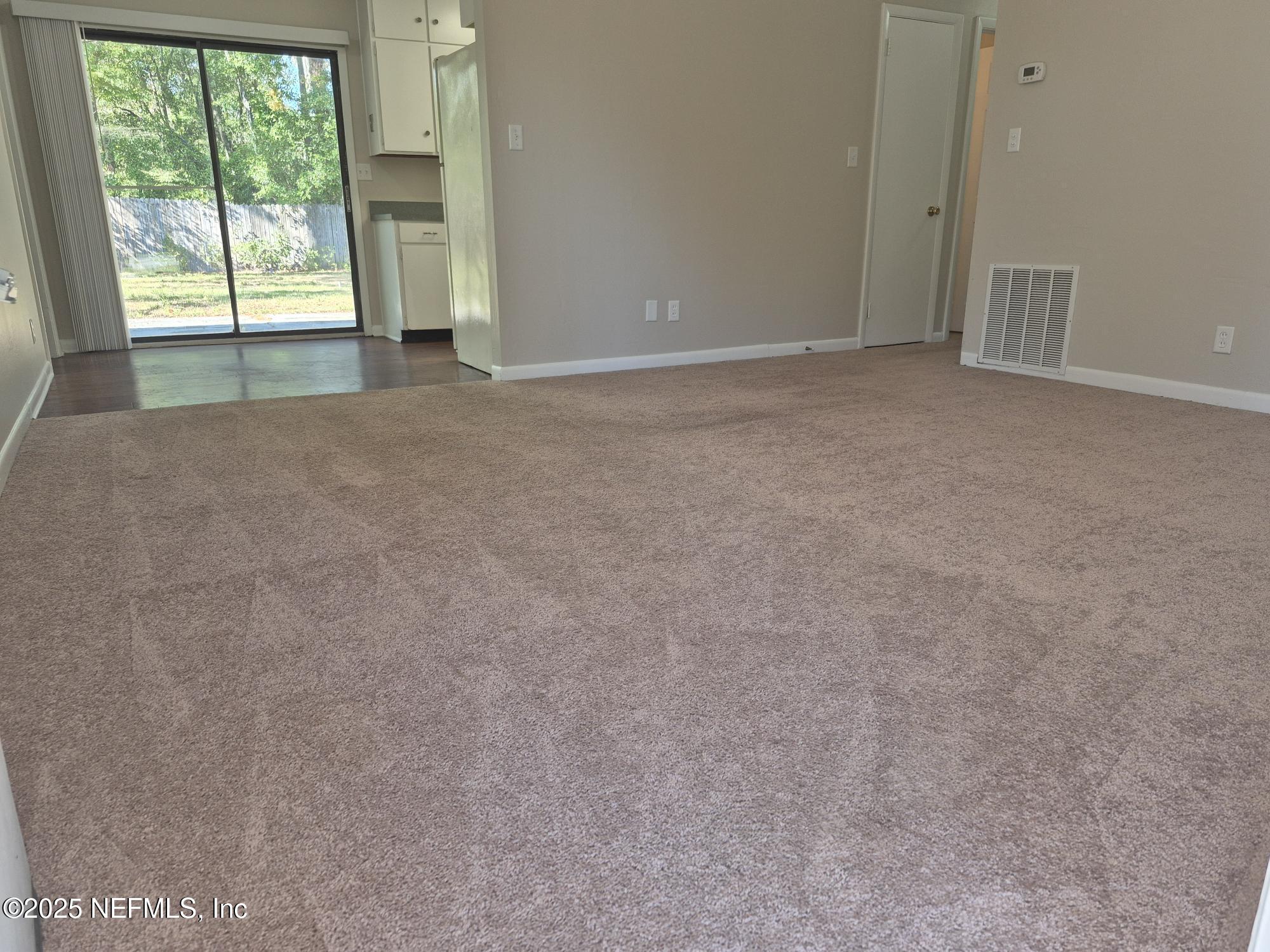223 Edson Drive Orange Park, FL 32073 - Photo 4 of 21 a view of an empty room with a window
