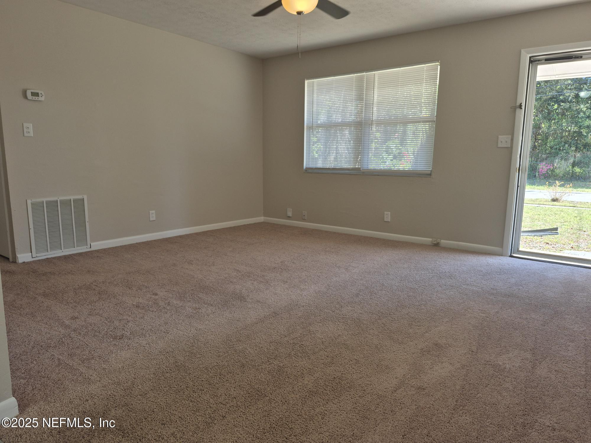 223 Edson Drive Orange Park, FL 32073 - Photo 7 of 21 an empty room with windows and closet