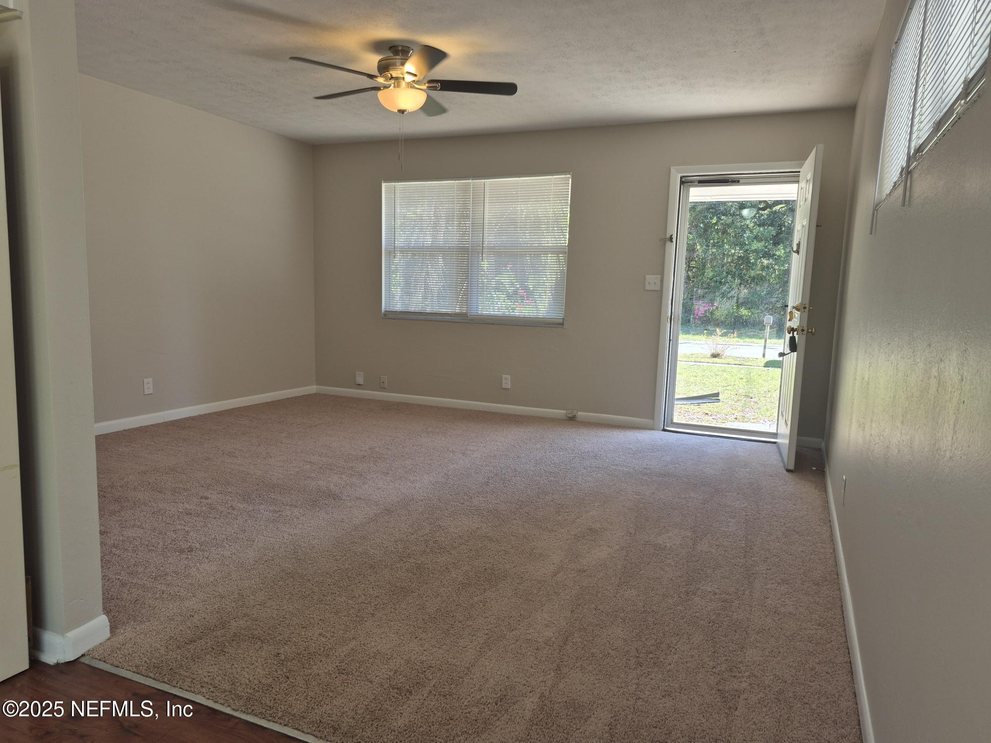 223 Edson Drive Orange Park, FL 32073 - Photo 8 of 21 a view of an empty room with a window