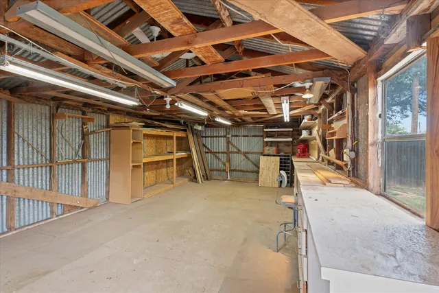 a view of an empty room with windows