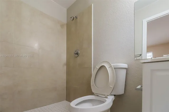 a bathroom with a toilet and a sink