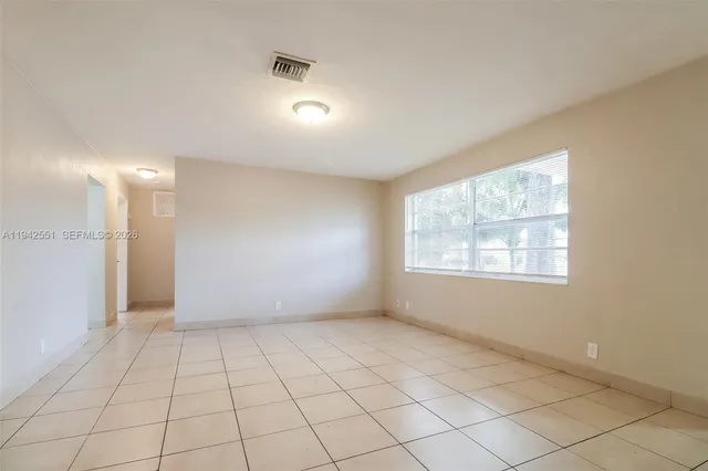a view of an empty room and window