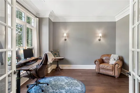 a living room with furniture fireplace and a flat screen tv