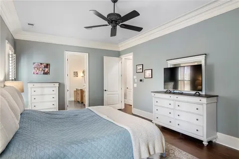 a bedroom with a bed and a view of kitchen