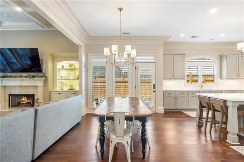 a living room with furniture and a large mirror