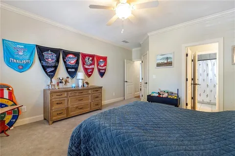 a bedroom with two beds and a chandelier