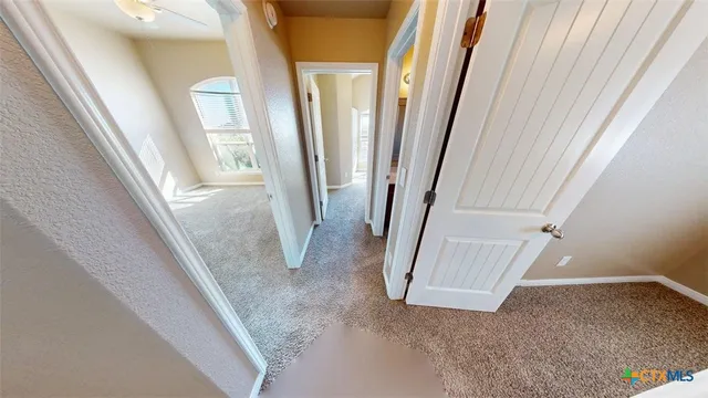 a view of a livingroom with stairs