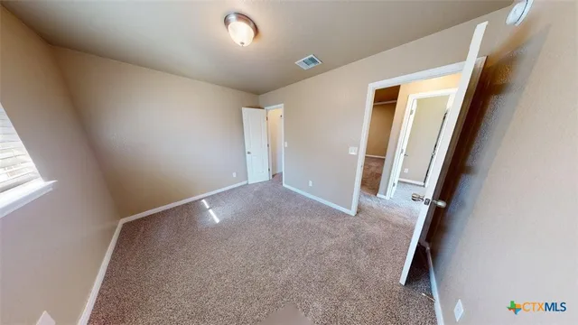 a view of a hallway view with staircase