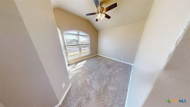 a view of a livingroom with a dishwasher and furniture