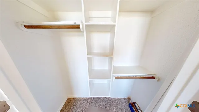 a bathroom with a sink mirror vanity and toilet