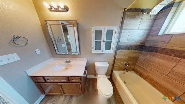 a view of a hallway view with wooden floor