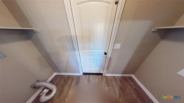 a bathroom with a glass door shower and tub