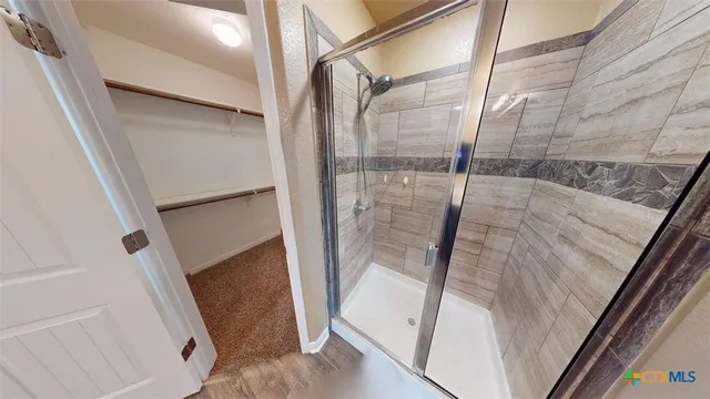 a bathroom with a sink and mirror with toilet