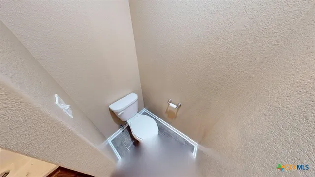 a view of a livingroom with a ceiling fan and window