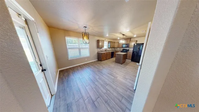 a view of a kitchen from a window