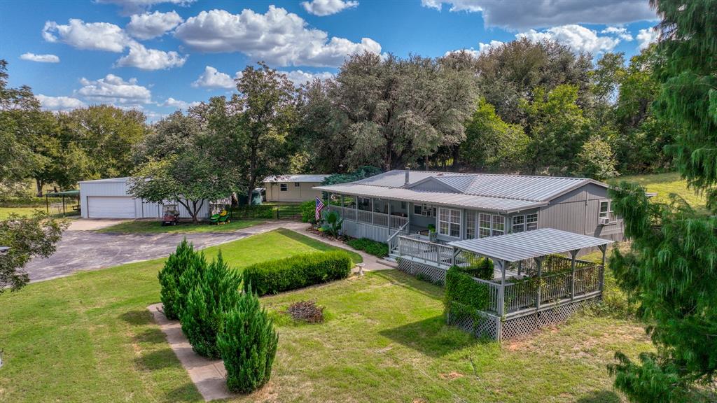 1240 Riverview Road Millsap, TX 76066 - Photo 3 of 36 a view of a house with backyard porch and sitting area