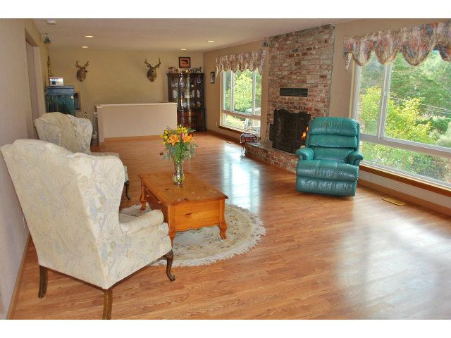 26928 Palomares Road Castro Valley, CA 94552 - Photo 8 of 10 a living room with furniture and a fireplace
