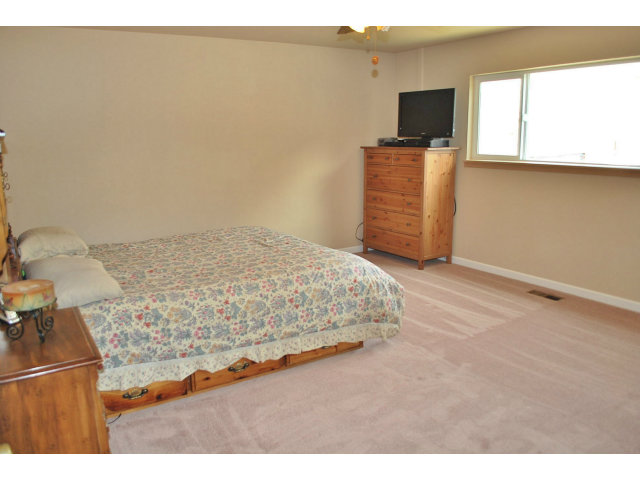 26928 Palomares Road Castro Valley, CA 94552 - Photo 9 of 10 a bedroom with a bed and flat screen tv