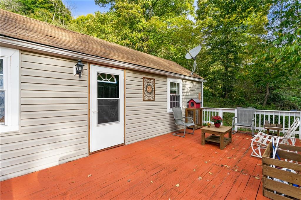 170 Paradise Road Industry, PA 15052 - Photo 20 of 24 a backyard of a house with wooden floor outdoor seating and yard in the back