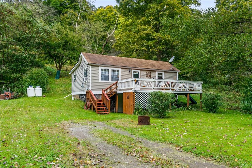 170 Paradise Road Industry, PA 15052 - Photo 24 of 24 a front view of a house with garden and trees