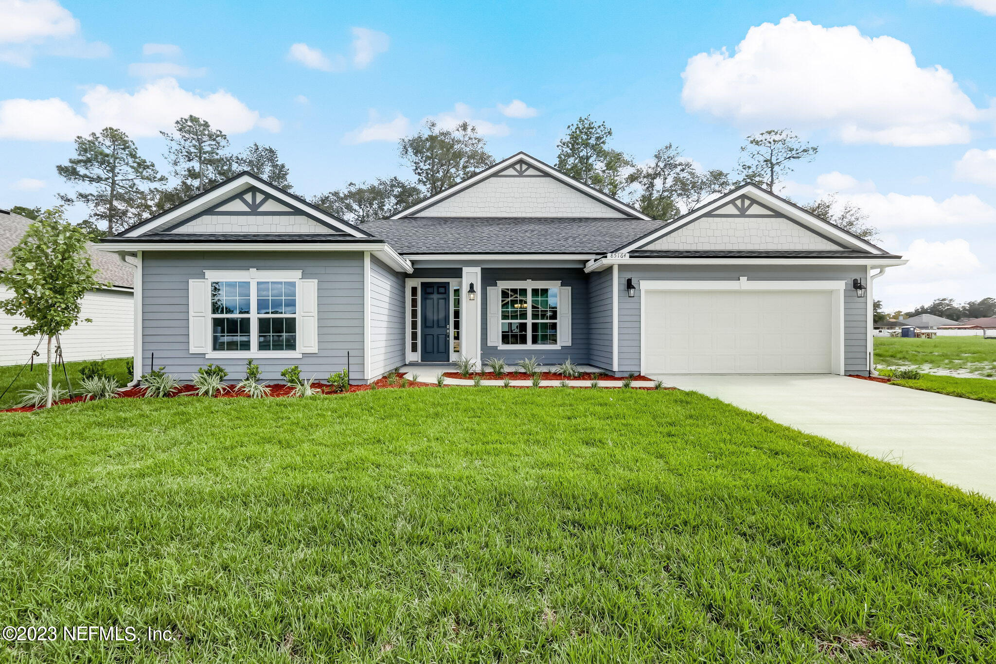 front view of a house with a yard