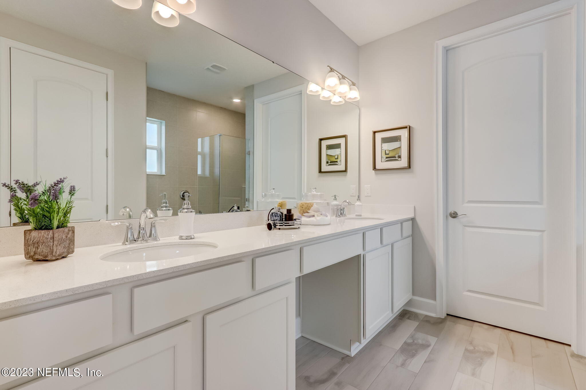 85164 Sandy Ridge Loop, Unit 19 Yulee, FL 32097 - Photo 14 of 23 a bathroom with a sink and a mirror