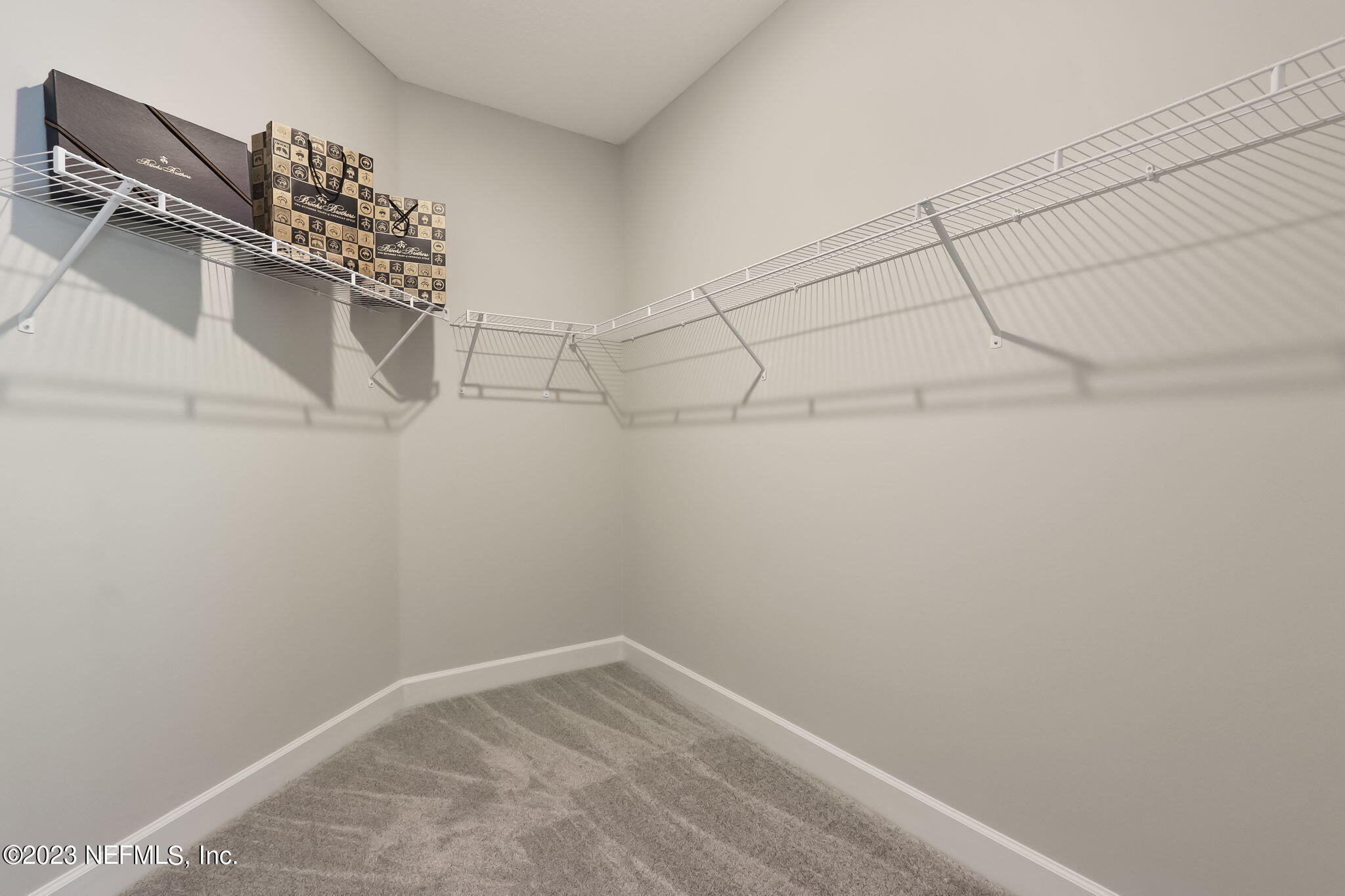 85164 Sandy Ridge Loop, Unit 19 Yulee, FL 32097 - Photo 16 of 23 a view of a room with racks on the wall