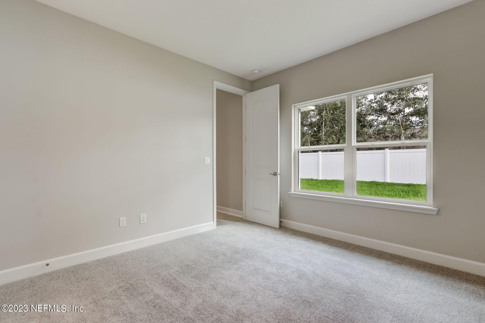 85164 Sandy Ridge Loop, Unit 19 Yulee, FL 32097 - Photo 17 of 23 an empty room with windows