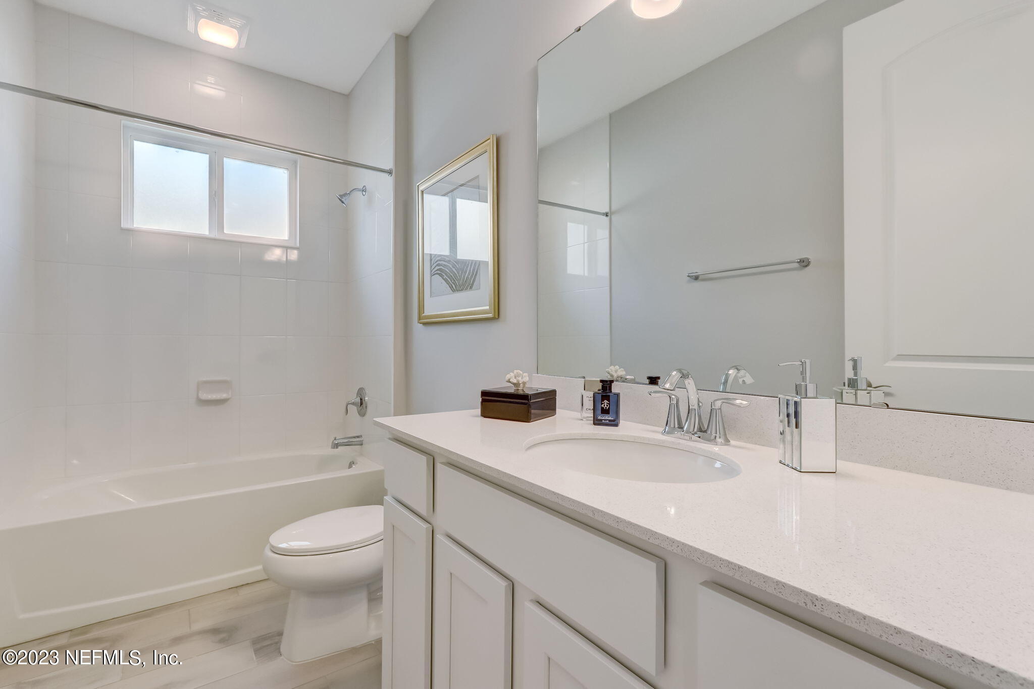 85164 Sandy Ridge Loop, Unit 19 Yulee, FL 32097 - Photo 19 of 23 a bathroom with a sink a toilet and shower