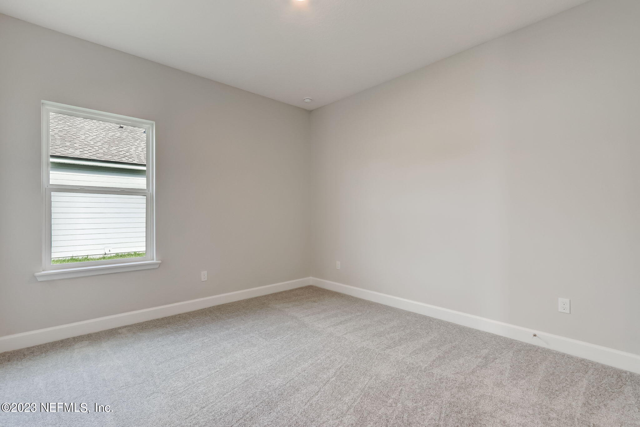 85164 Sandy Ridge Loop, Unit 19 Yulee, FL 32097 - Photo 20 of 23 an empty room with a window