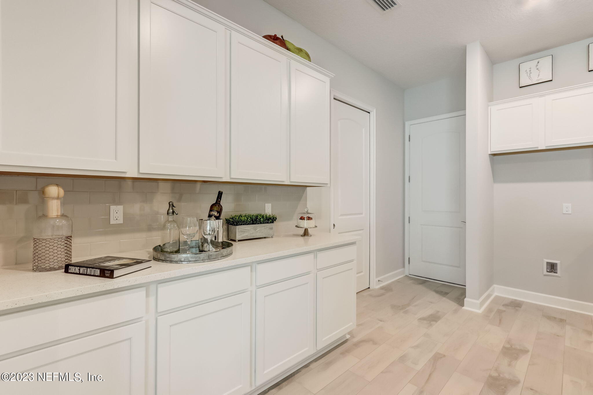 85164 Sandy Ridge Loop, Unit 19 Yulee, FL 32097 - Photo 9 of 23 a kitchen with a sink and cabinets