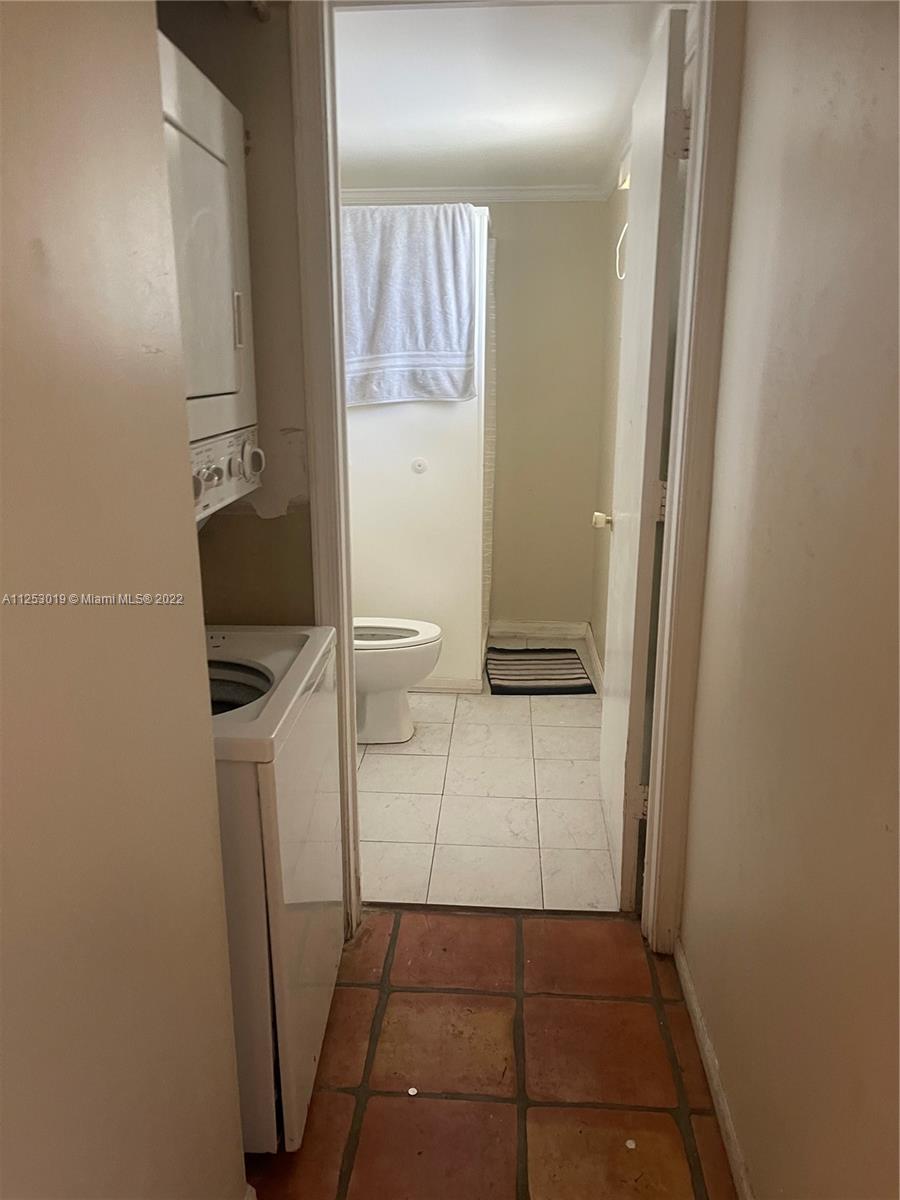 812 Southwest 9th St Circle, Unit 101 Boca Raton, FL 33486 - Photo 11 of 15 a bathroom with a sink and a toilet