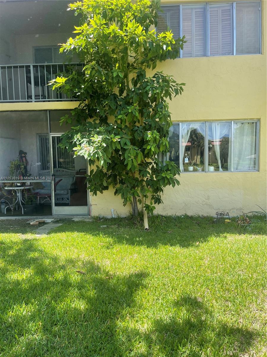 812 Southwest 9th St Circle, Unit 101 Boca Raton, FL 33486 - Photo 15 of 15 a view of swimming pool with lawn chairs and plants
