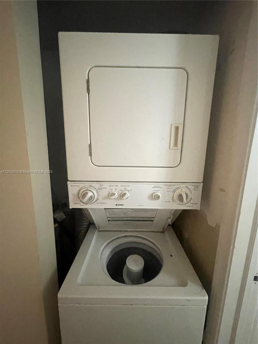 812 Southwest 9th St Circle, Unit 101 Boca Raton, FL 33486 - Photo 10 of 15 a utility room with dryer and washer