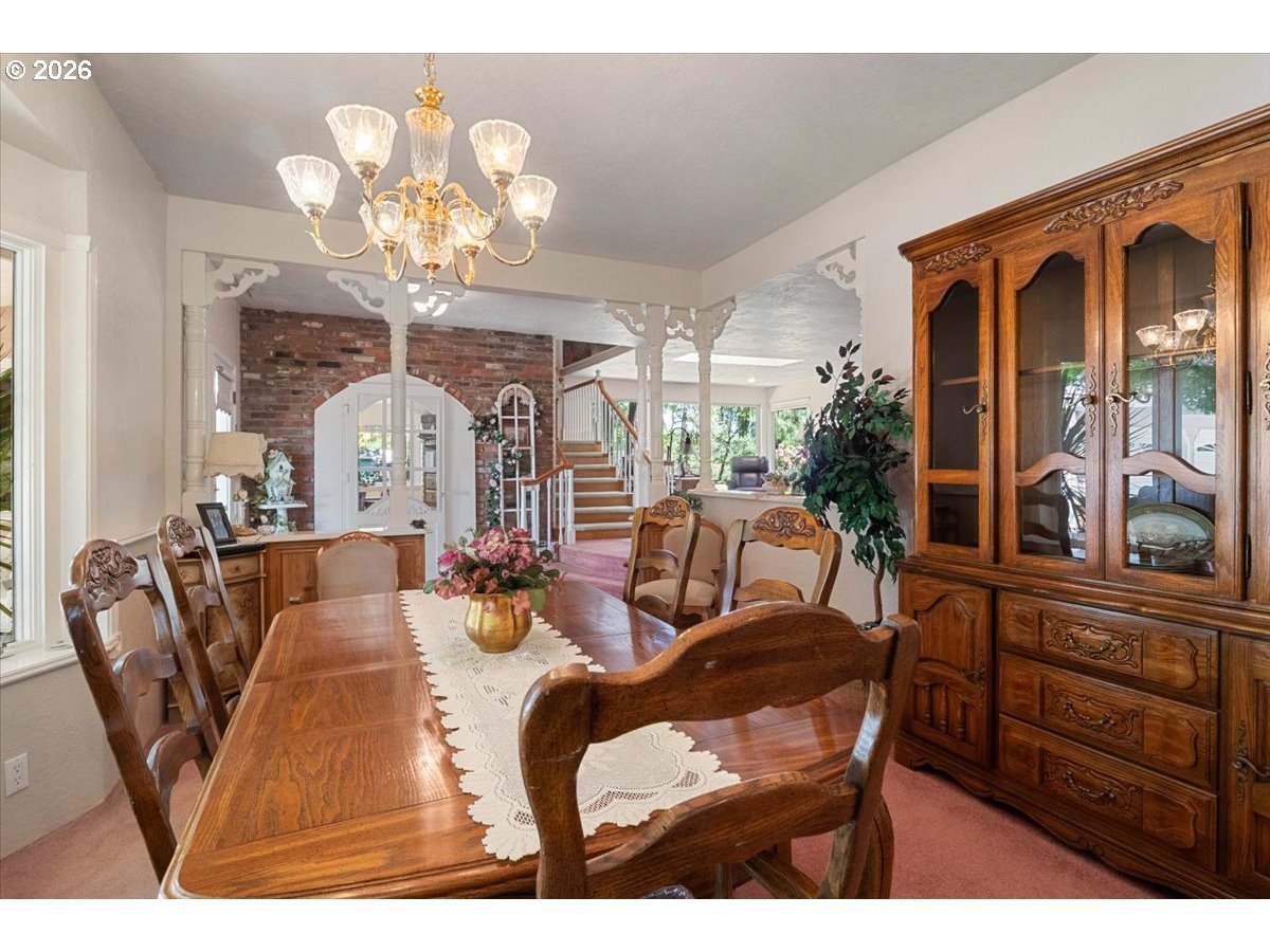 1300 Fair Oaks Road Oakland, OR 97462 - Photo 7 of 48 a living room with furniture a chandelier and a dining table