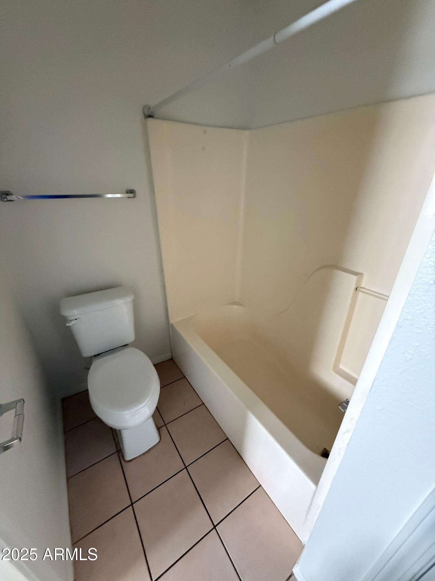 712 East 17th Street, Unit D Douglas, AZ 85607 - Photo 13 of 16 a bathroom with a toilet and a shower