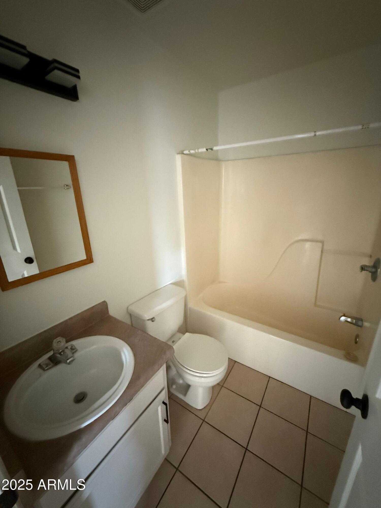712 East 17th Street, Unit D Douglas, AZ 85607 - Photo 9 of 16 a bathroom with a sink toilet and shower
