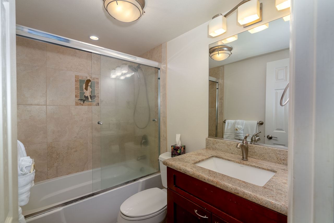 2430 South Kihei Road, Unit 206 Kihei, HI 96753 - Photo 14 of 26 a bathroom with a granite countertop sink toilet and shower
