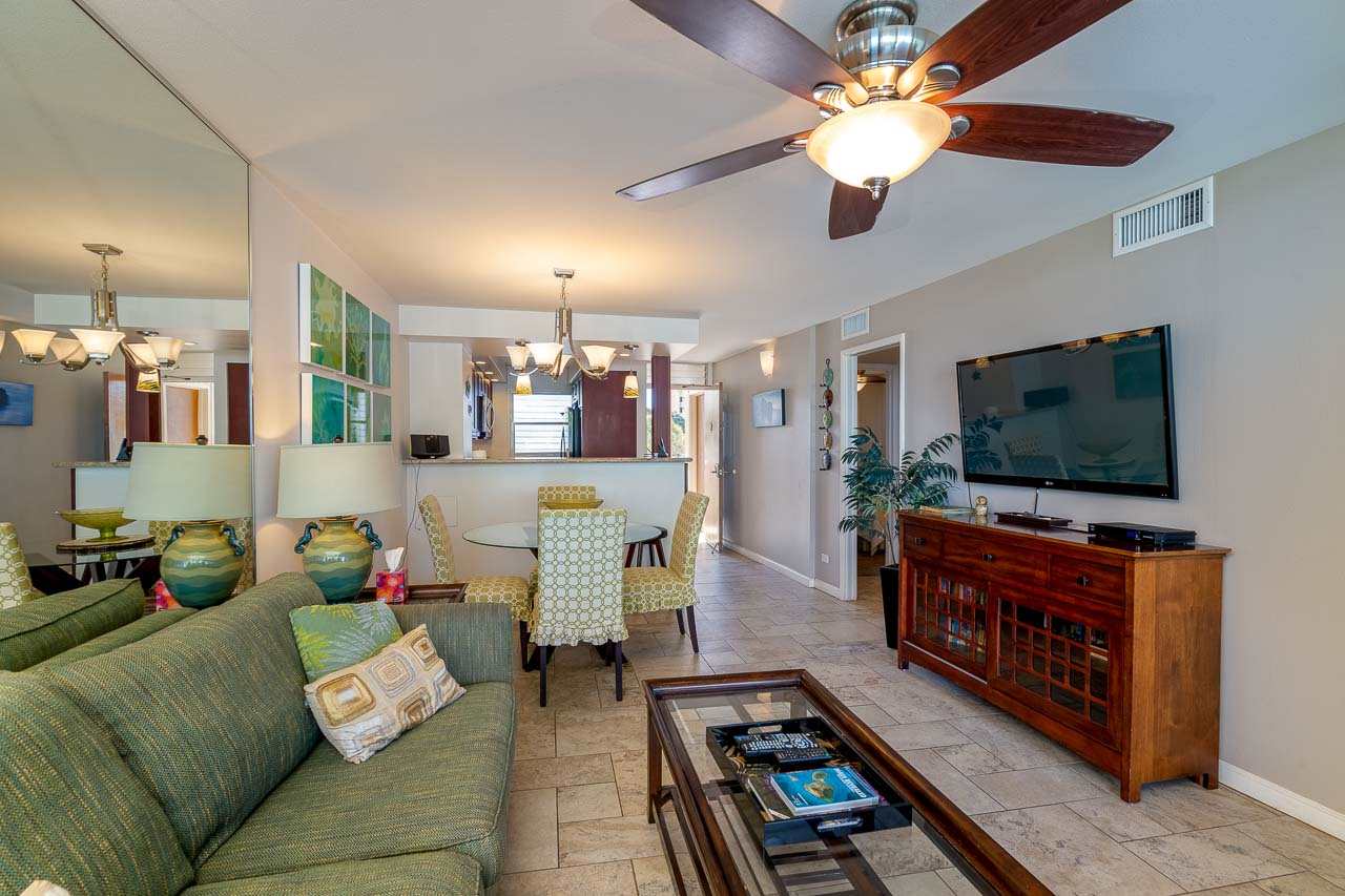 2430 South Kihei Road, Unit 206 Kihei, HI 96753 - Photo 5 of 26 a living room with furniture and a flat screen tv