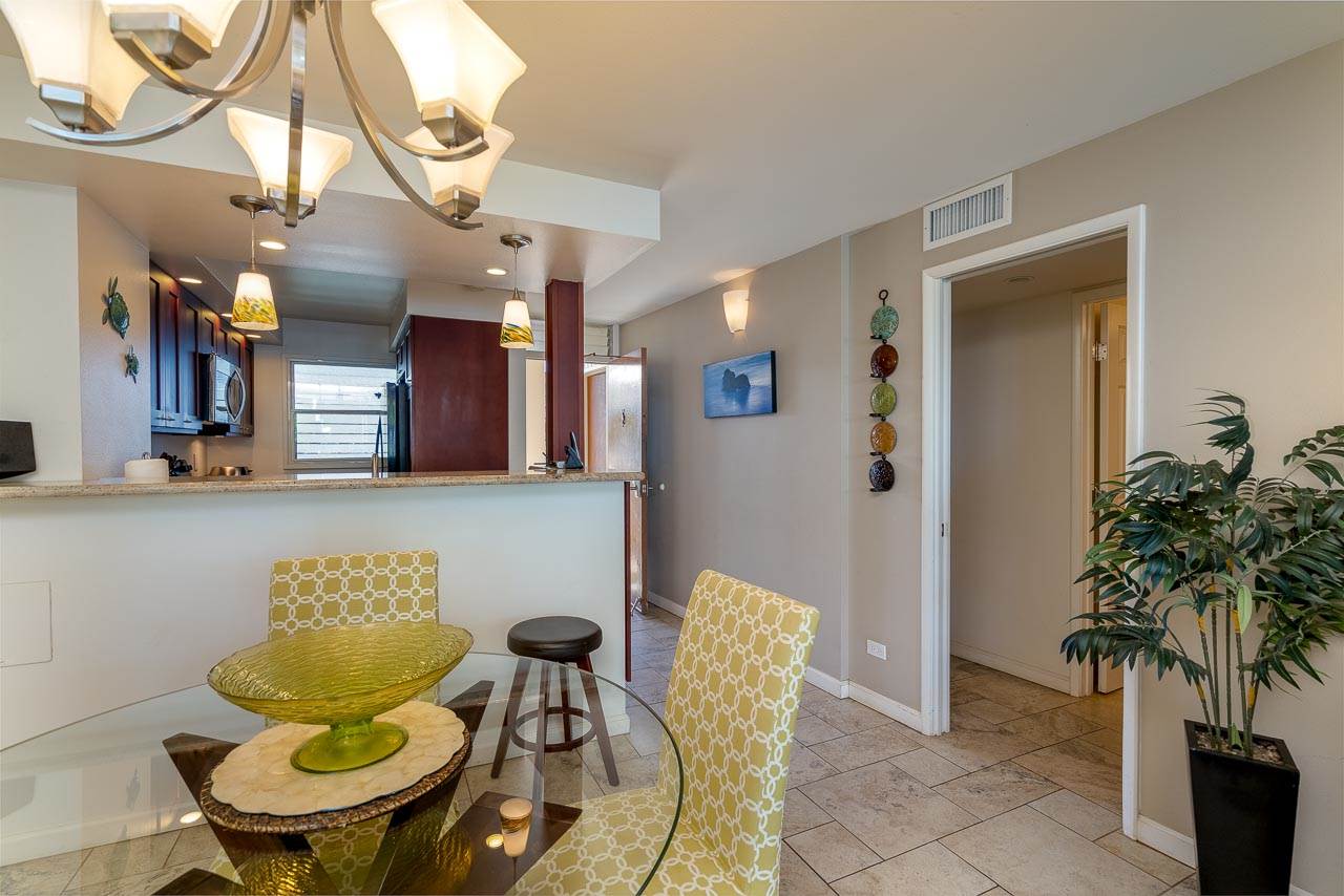 2430 South Kihei Road, Unit 206 Kihei, HI 96753 - Photo 6 of 26 a living room with furniture and a potted plant